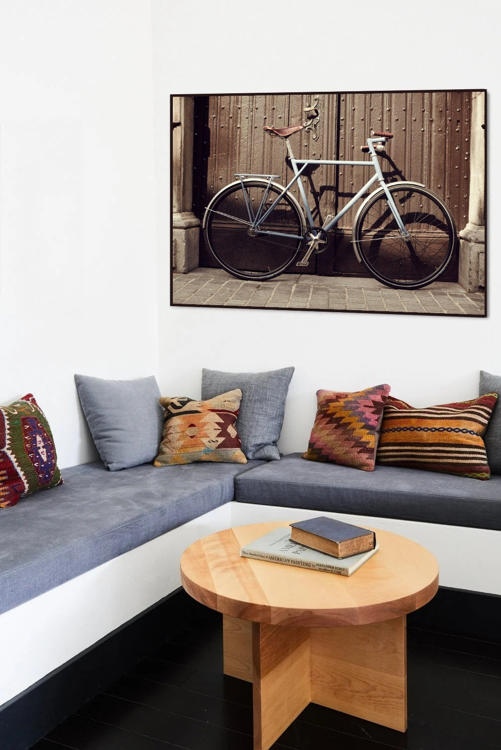Opening Doors cycling print in a black frame on the wall