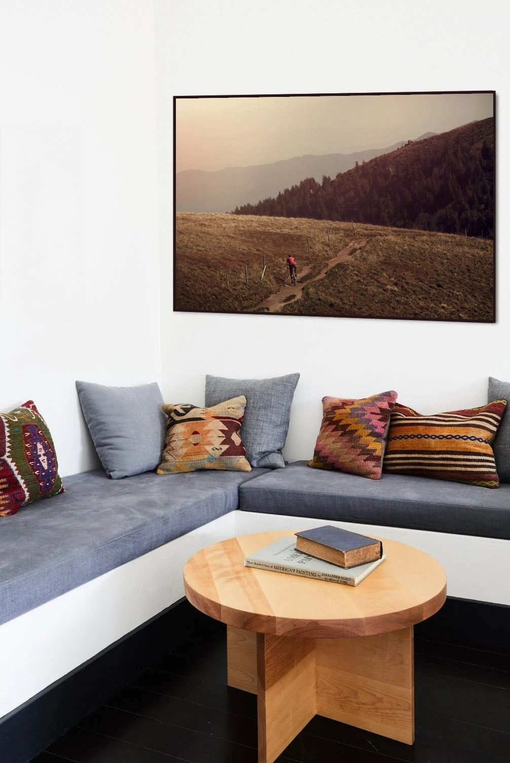 Ridge Rider cycling print in a black frame on the wall