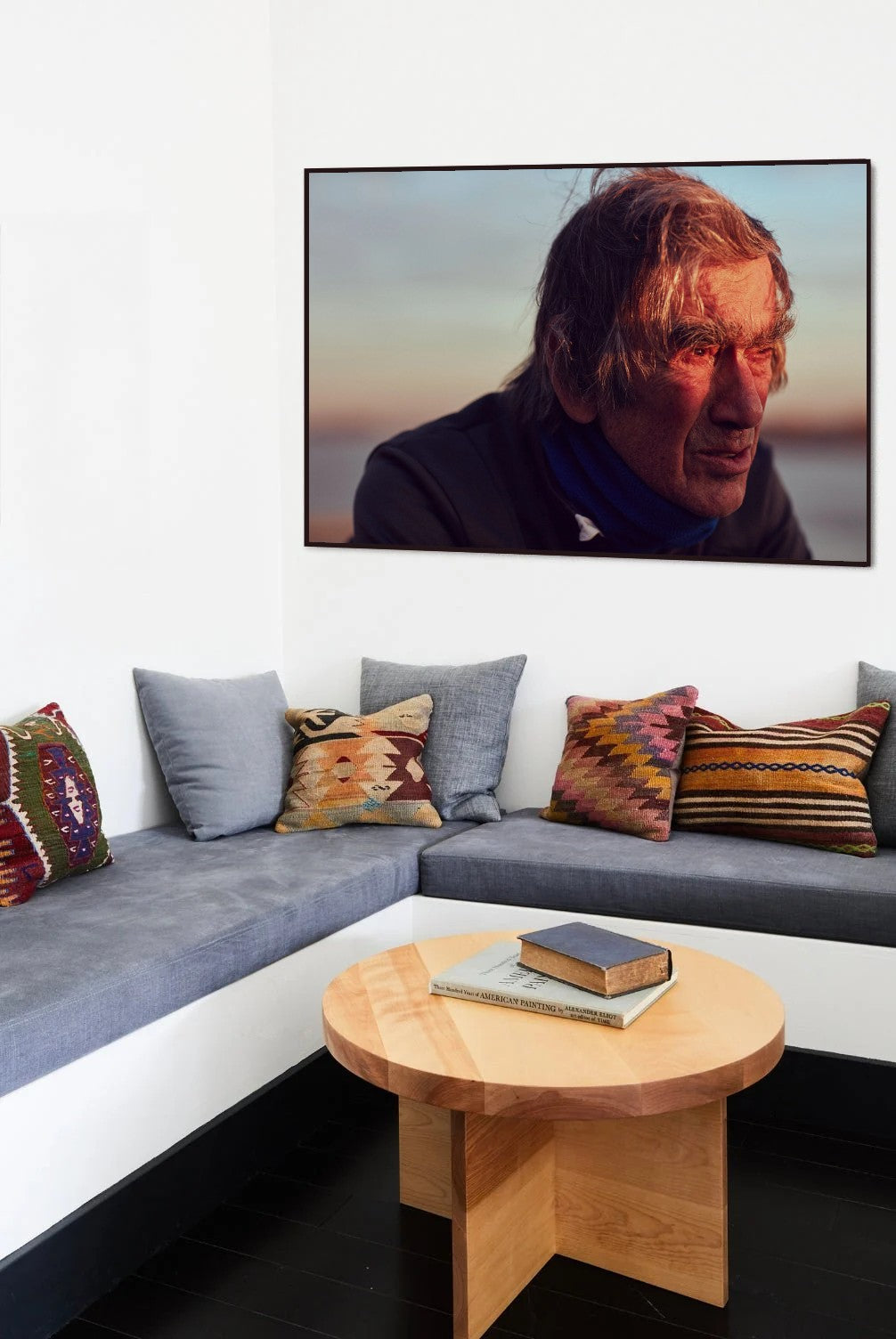 Golden Eye Man of Steel cycling portrait print in a black frame on a living room wall