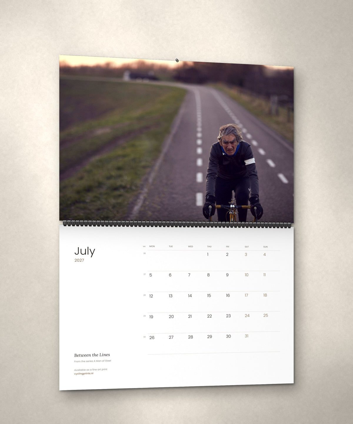 July 2027 – Between the Lines, a page from the A Man of Steel cycling photography wall calendar by Ryan Edy