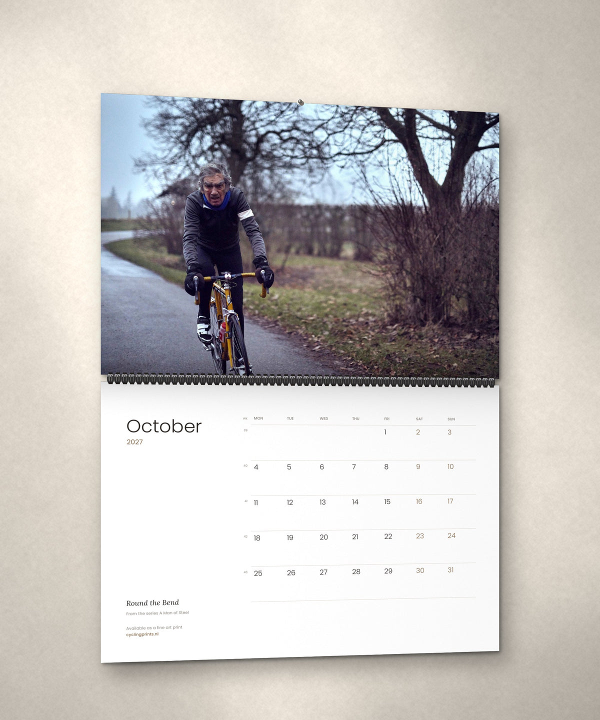 October 2027 – Round the Bend, a page from the A Man of Steel cycling photography wall calendar by Ryan Edy
