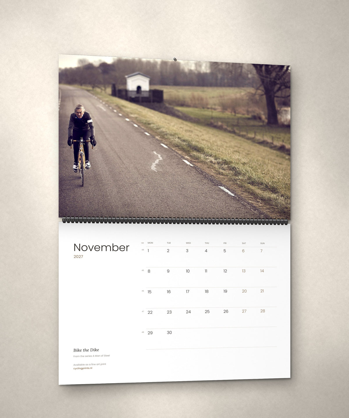 November 2027 – Bike the Dike, a page from the A Man of Steel cycling photography wall calendar by Ryan Edy