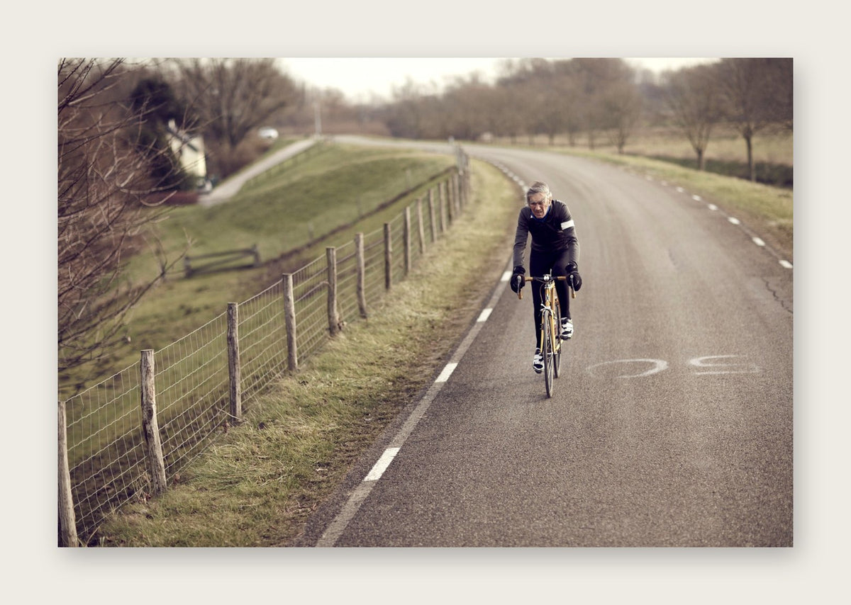 Windswept – A Man of Steel fine art cycling postcard by Ryan Edy