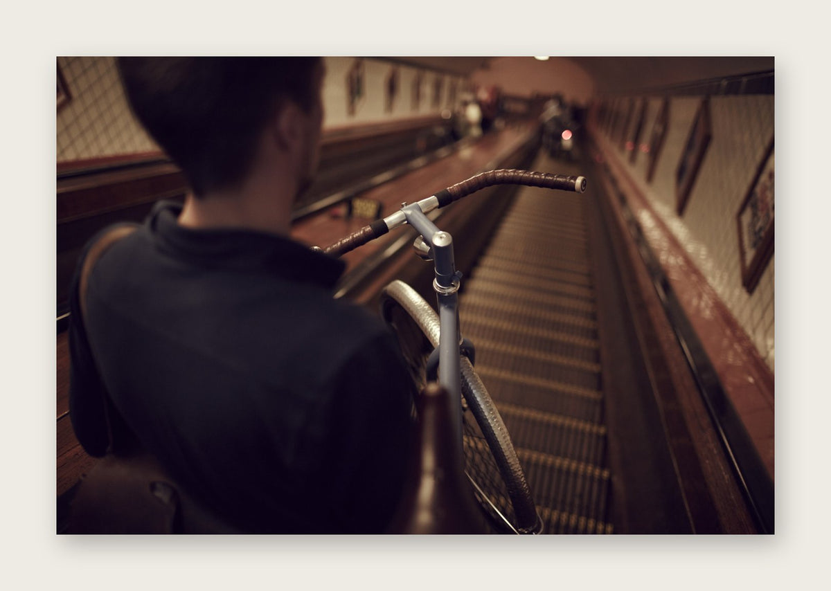 Down Town – The Commuter fine art cycling postcard by Ryan Edy